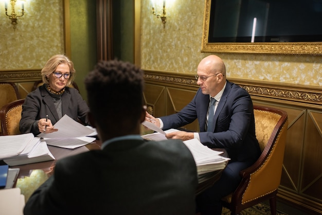 group contemporary lawyers gathered by table paperwork 274679 29822